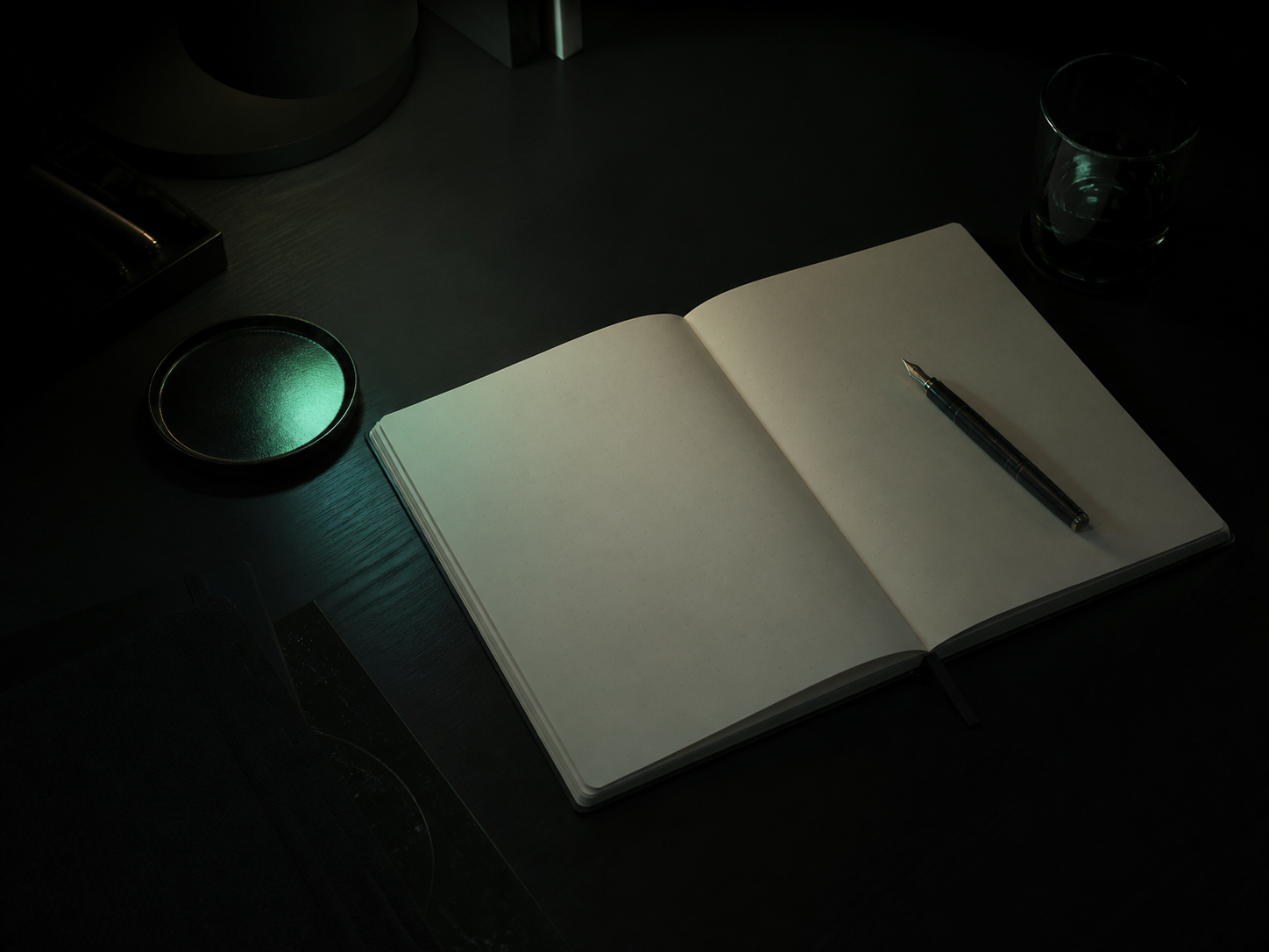 Open notebook on a dark desk